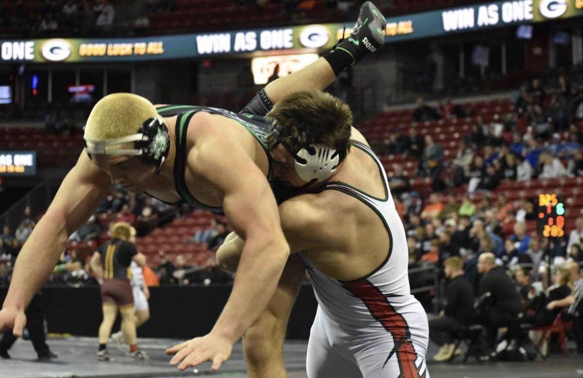 Senior Jakob Martin throws his opponent at the WIAA State Individual Wrestling Tournament taking place from Feb. 26-28. 