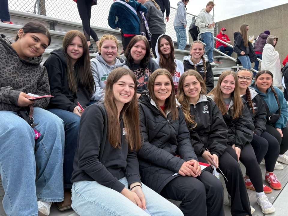 The girls' softball team visits the Wisconsin Badgers softball team on April 11 for team bonding and learning experiences.	