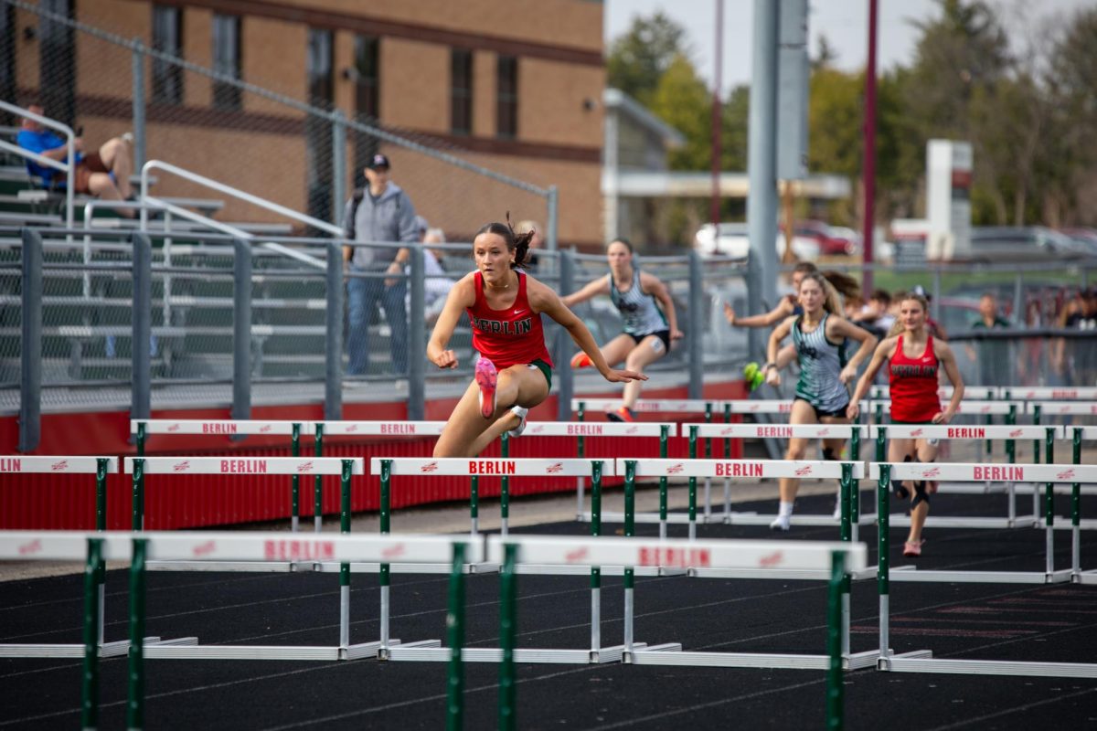 Sophomore Selci Sirrell jumps the hurdle at the South Conference Quad on April 14, 2026, in Berlin. As Sirrell beat another school record, she emphasized which of her favorite school record beat. “My high jump was because that was my first meet of freshman year, and I went there and actually beat it,” Sirrell said. 