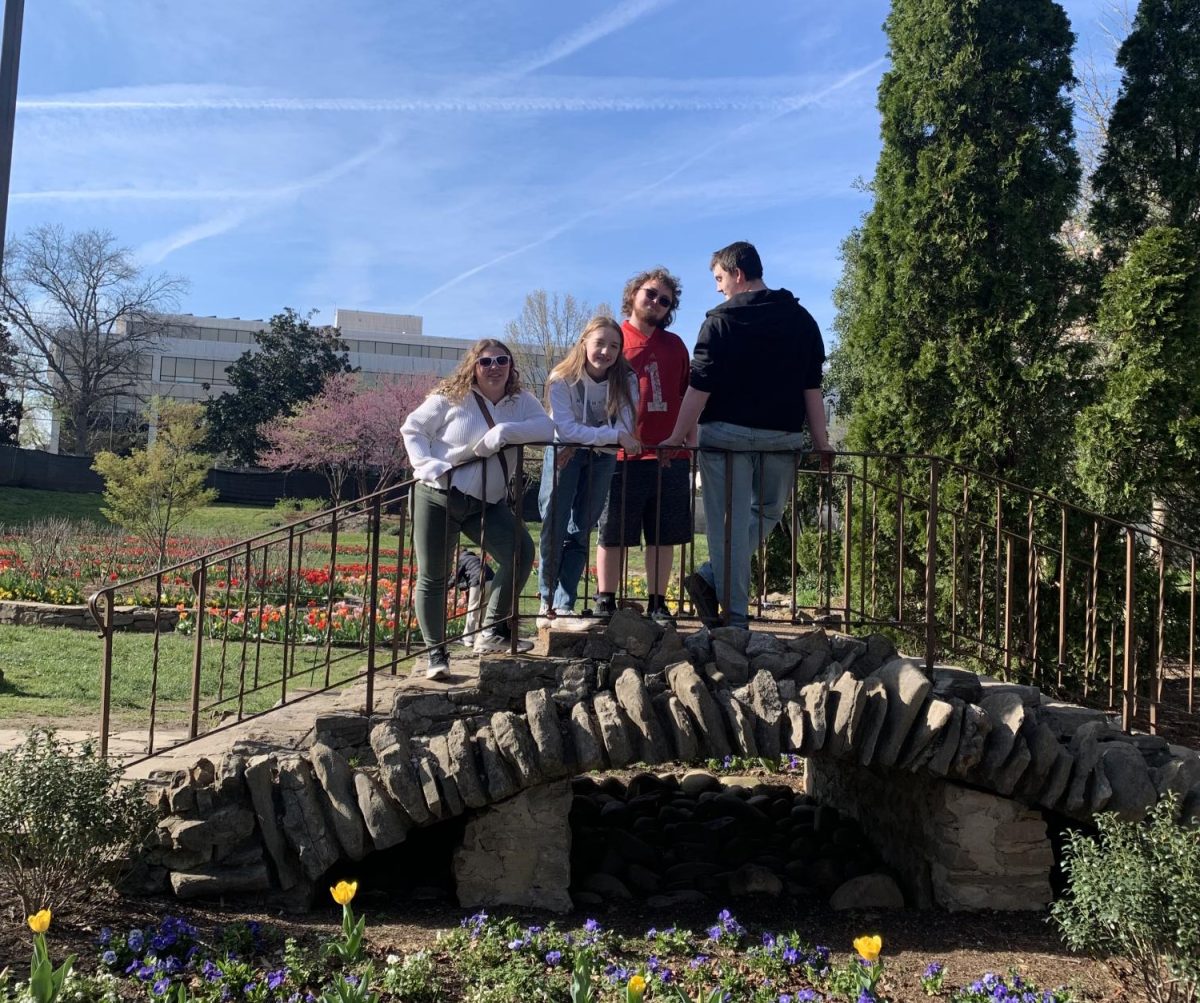From left to right: sophomore Elizabeth Kasuboski, junior Emelia Beulen, junior Adrian Gaetzke, and junior Gary Phelps visit Centennial Park, inside the Sunken Garden on March 23.
