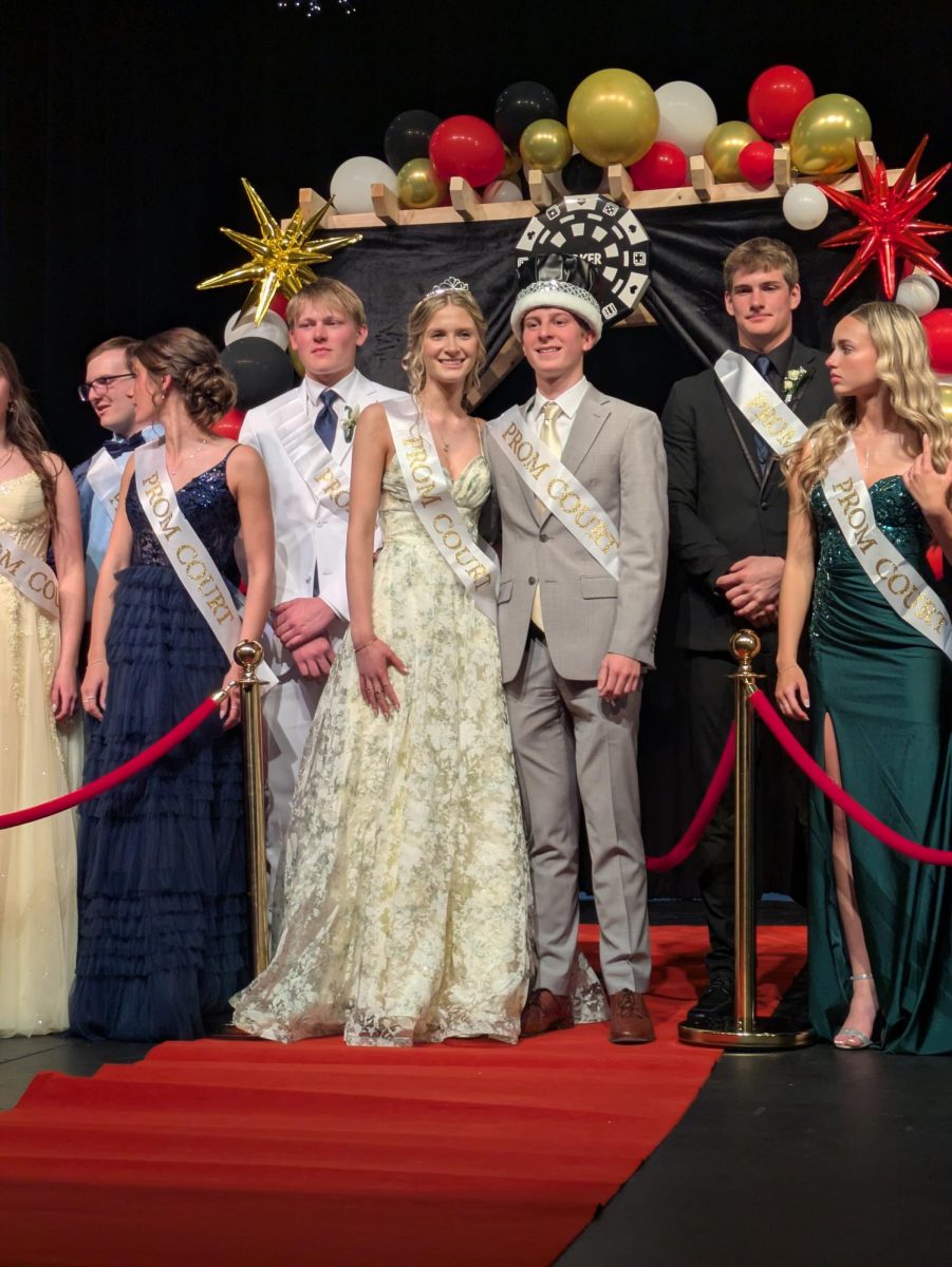 The prom queen and king, seniors Lillian Johnson and Daniel Dunbar, pose with the rest of the prom court on May 2.
