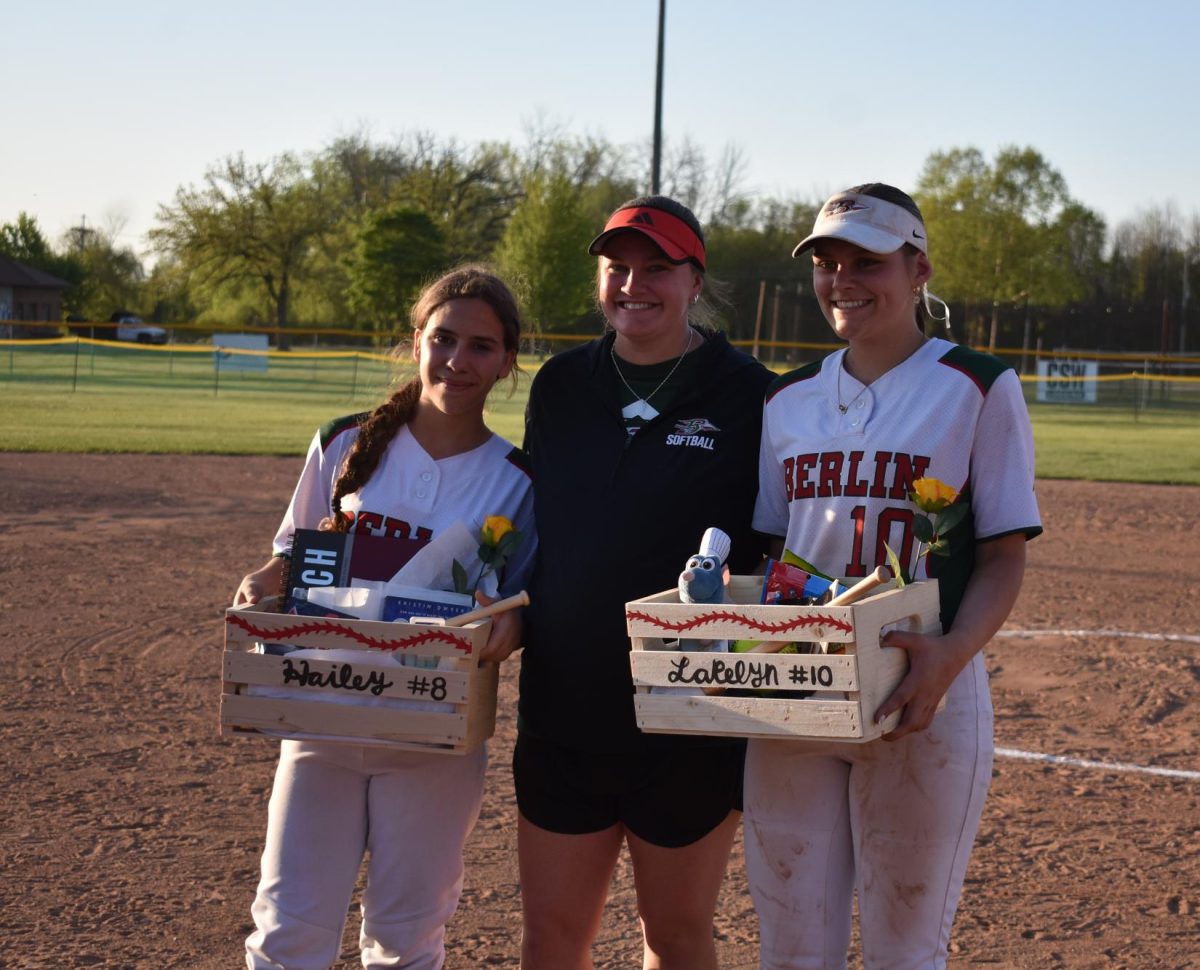 Senior Hailey Rodriguez (8), head softball coach Kimberly Gensel and senior Lakelyn Sobieski (10) celebrate Senior Night after a home game win against North Fond Du Lac, May 15.