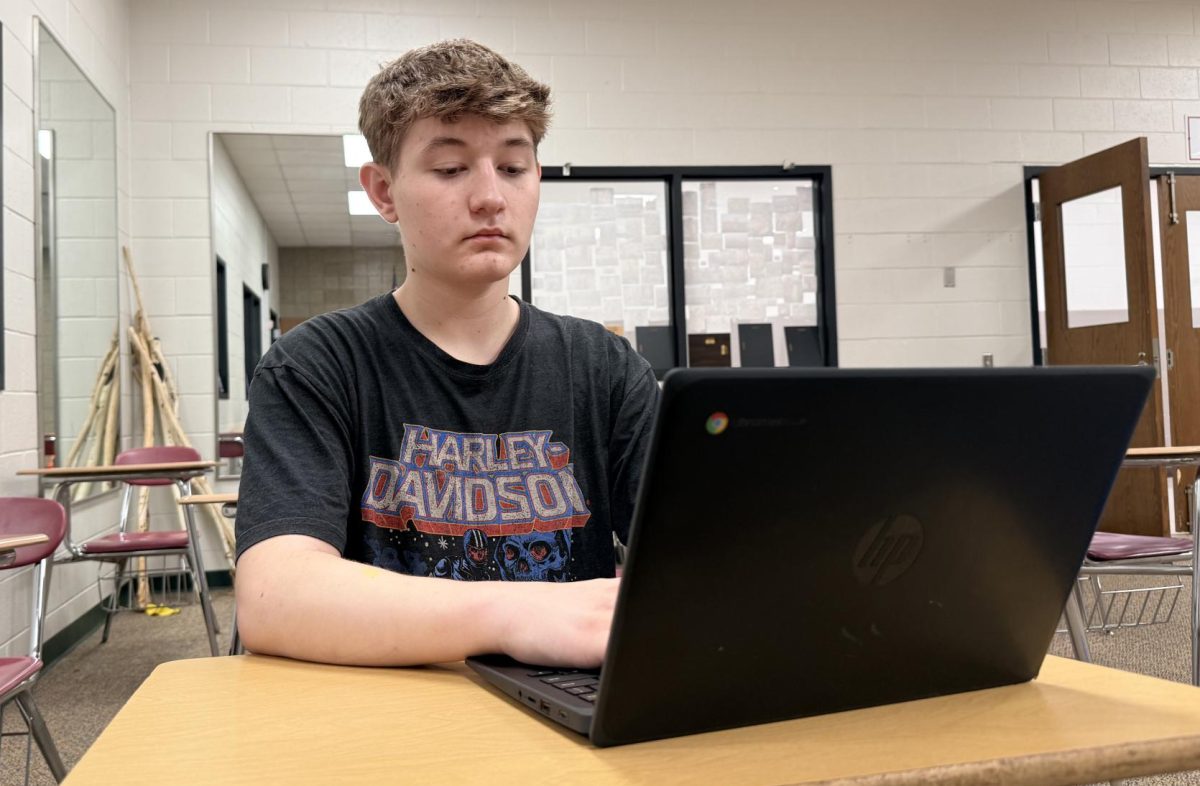 Junior Colin Dalton signs into his University of Wisconsin-Oshkosh account. Dalton has taken several CAPP classes in the past and will continue to take them. “If you’re planning on going to college, it can save you money because it’s cheaper to take the courses here compared to having to go to college,” Dalton said.
