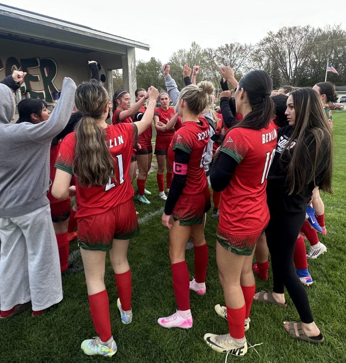  The varsity soccer team comes together in celebration for their 4-1 win against Mauston on April 30. The team has beaten all conference teams throughout the first half of their season. “As the season goes on, we’ve understood more and more how to do this as a team, and we’re all excited to finish this season off strong,” junior Gwendolyn Bruce-DeMuri said.   Their next game is away against New London, an opponent they have not faced, on May 19.
