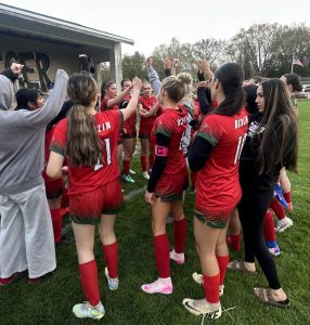 The varsity soccer team comes together in celebration for their 4-1 win against Mauston on April 30. The team has beaten all conference teams throughout the first half of their season. “As the season goes on, we’ve understood more and more how to do this as a team, and we’re all excited to finish this season off strong,” junior Gwendolyn Bruce-DeMuri said. Their next game is away against New London, an opponent they have not faced, on May 19.