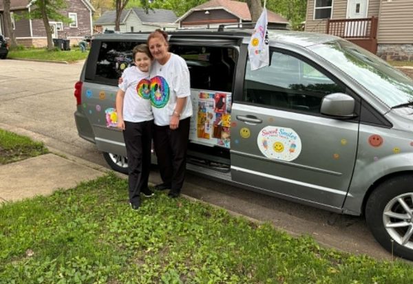 Ice cream truck owner Sue-Z Zenku (right) and son Dre Zenku (left) stand in front of their ice cream truck. Zenku started selling ice cream earlier this month.  “It was very difficult to launch this project with many setbacks, but I was determined to start this business and teach my son Dre about business and great customer service.” Zenku said