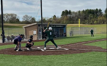 Senior Royce Lichtenburg (8) steps up to bat against Wisconsin Dells on Tuesday, April 28, 2026. “I think our team's doing better this year because we have new coaches, and our practices are structured better. Our team is fully committed this year. We weren’t committed last year, and this year we believe we're going to win,” Lichtenburg said. 
